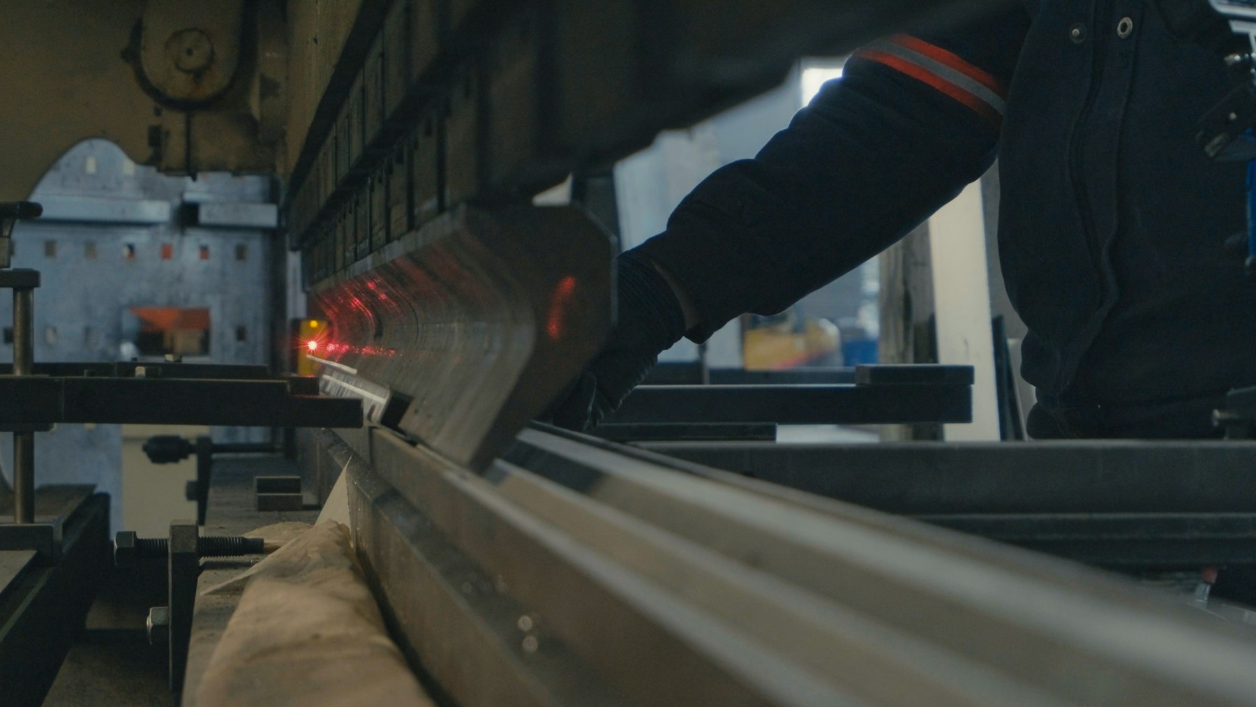 Representative skilled operator using precision sheet-metal bending machinery